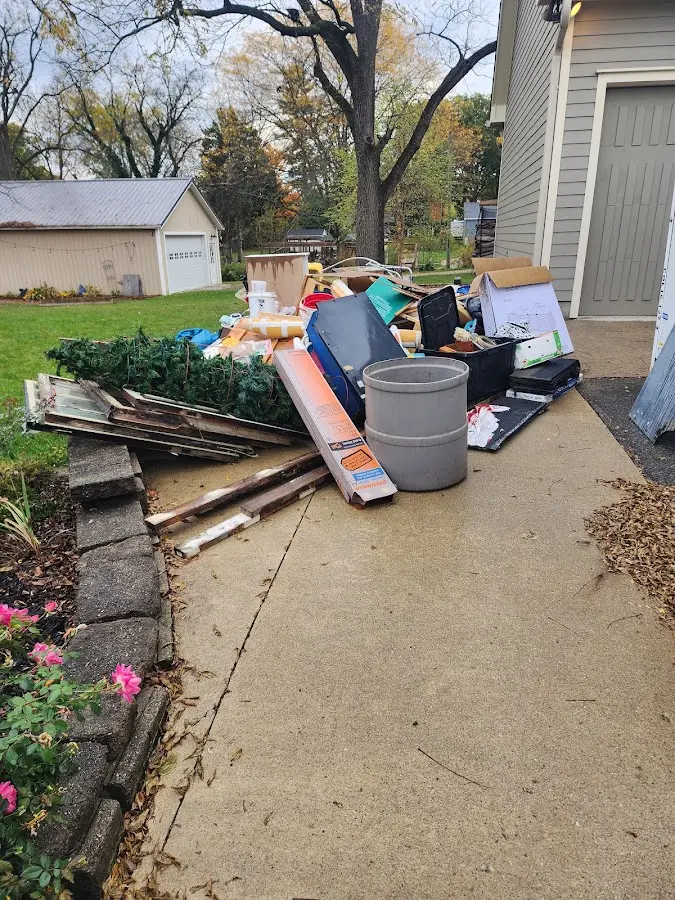 Dumpster being loaded with debris for Estate Cleanout Dumpster Rental in La Grange Park